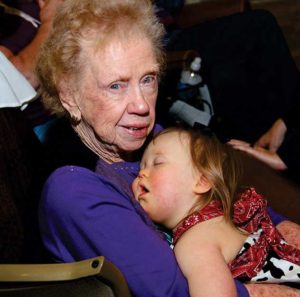 Mary Hagan holding Kate Brooks, granddaughter of NFDA President Robby and Betty Bates, of De Kalb, Texas at the 2013 NFDA Convention, Austin, Texas.
